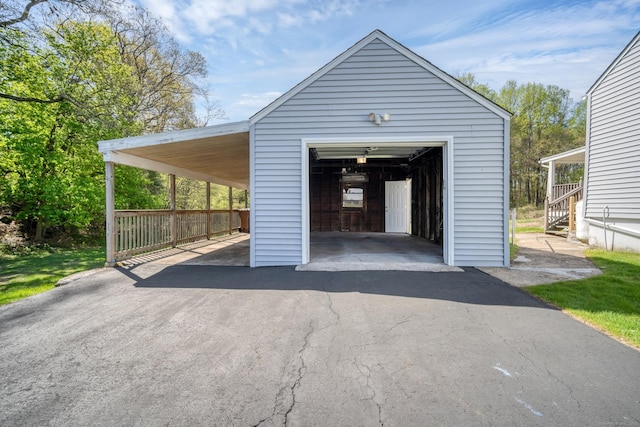 garage with a garage and aphalt driveway