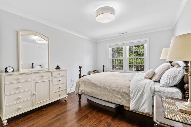 bedroom featuring crown molding, baseboards, visible vents, and dark wood-type flooring
