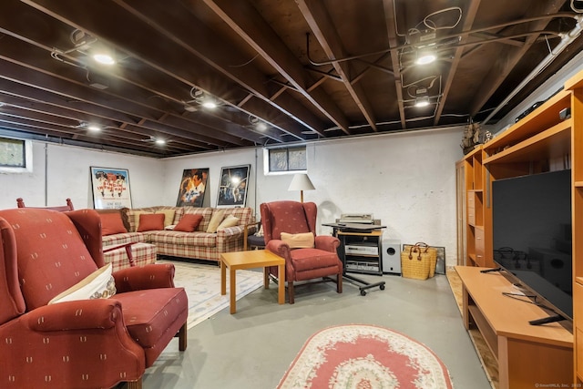 living area featuring finished concrete flooring