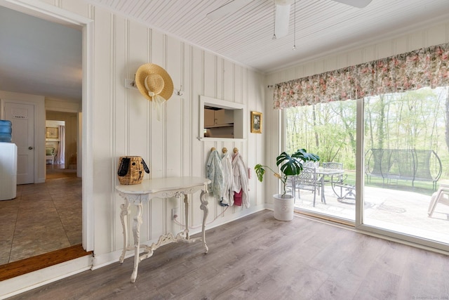 interior space featuring a ceiling fan and wood finished floors