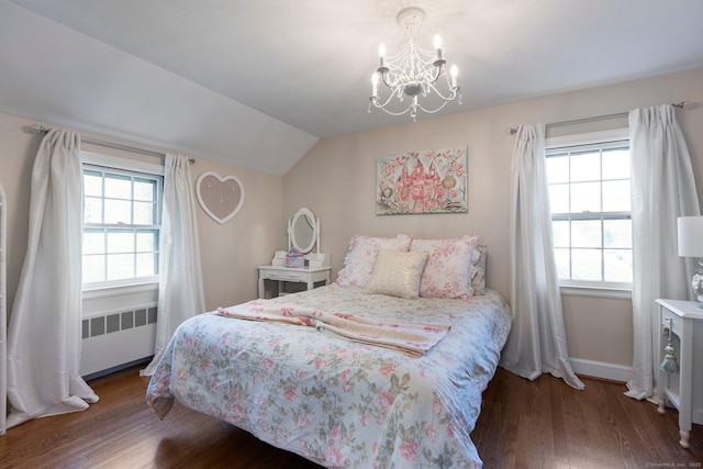 bedroom with a notable chandelier, radiator heating unit, baseboards, wood finished floors, and lofted ceiling