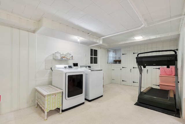 laundry room with light carpet, laundry area, and washer and dryer