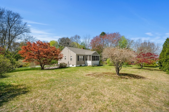 view of yard with a sunroom