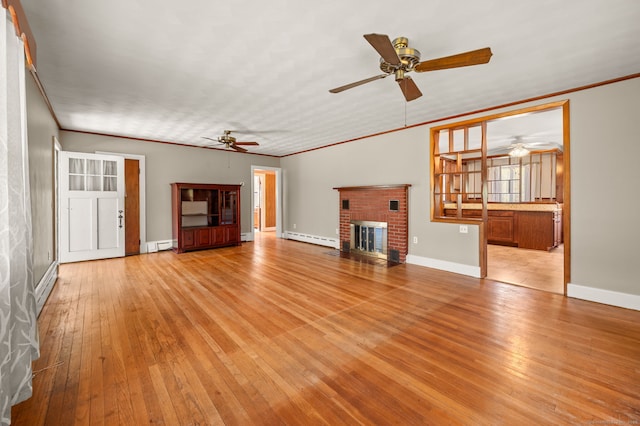 unfurnished living room with a baseboard radiator, a baseboard heating unit, light wood-type flooring, and ceiling fan