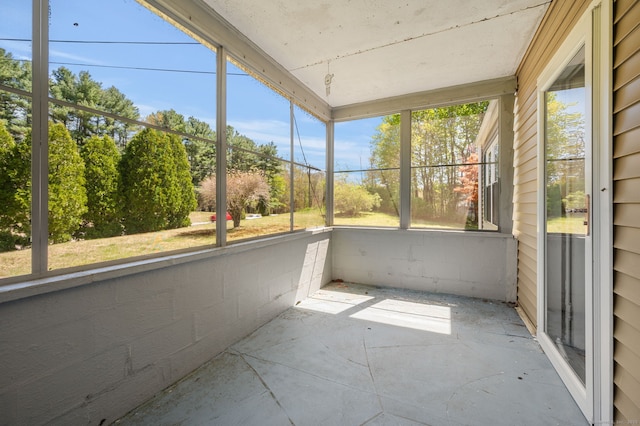 unfurnished sunroom with plenty of natural light