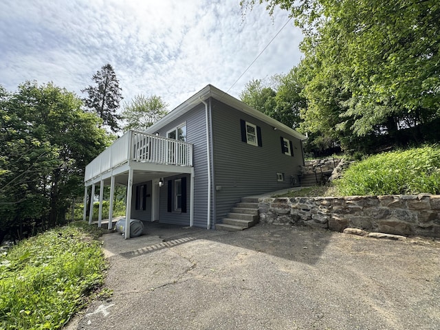 59 Fairfax St, Waterbury, CT 06704 - view of home's exterior featuring a deck and driveway