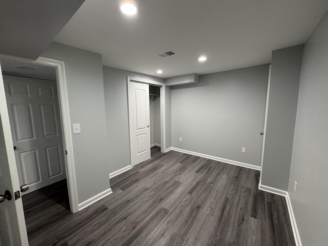 59 Fairfax St, Waterbury, CT 06704 - unfurnished bedroom with dark wood-type flooring, baseboards, recessed lighting, and a closet