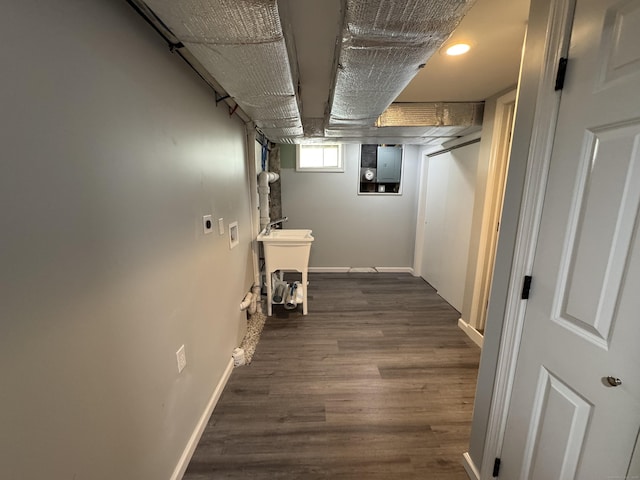 59 Fairfax St, Waterbury, CT 06704 - below grade area with dark wood-type flooring, baseboards, and a sink