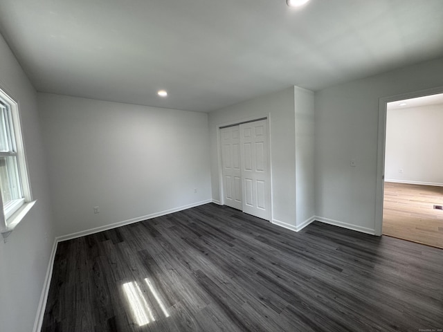 59 Fairfax St, Waterbury, CT 06704 - unfurnished bedroom with baseboards, dark wood finished floors, recessed lighting, and a closet