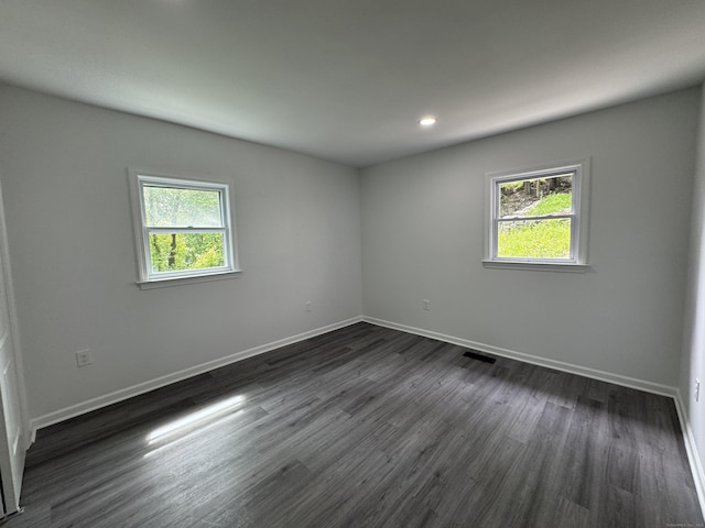 59 Fairfax St, Waterbury, CT 06704 - empty room featuring plenty of natural light, baseboards, dark wood-style floors, and recessed lighting