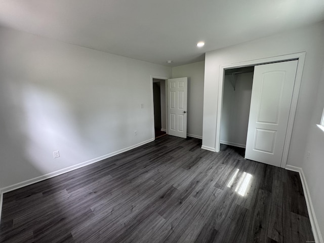 59 Fairfax St, Waterbury, CT 06704 - unfurnished bedroom with dark wood-type flooring, baseboards, a closet, and recessed lighting