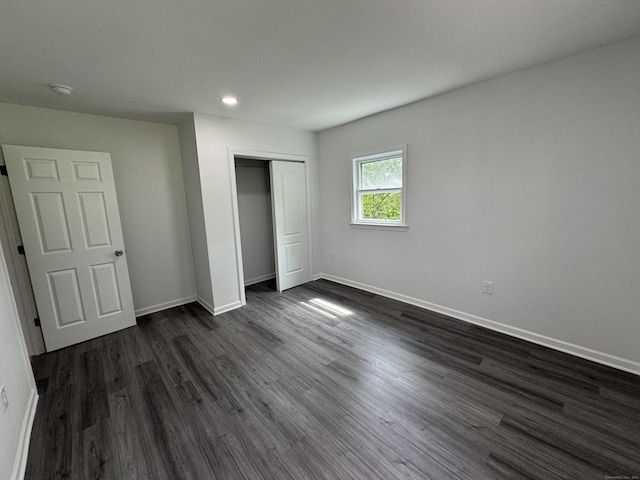 59 Fairfax St, Waterbury, CT 06704 - unfurnished bedroom featuring a closet, baseboards, dark wood-type flooring, and recessed lighting