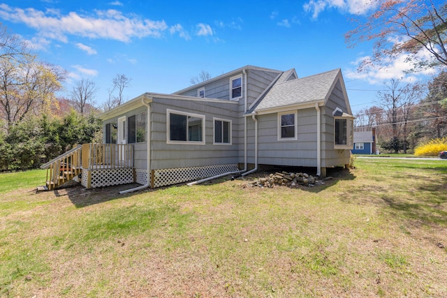 back of property with a lawn