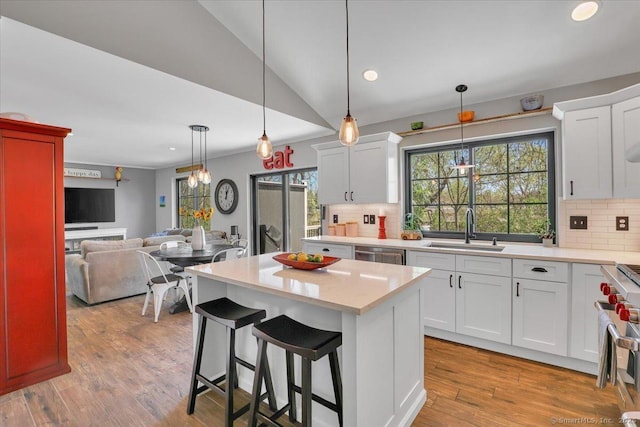 kitchen featuring a sink, appliances with stainless steel finishes, tasteful backsplash, and light countertops