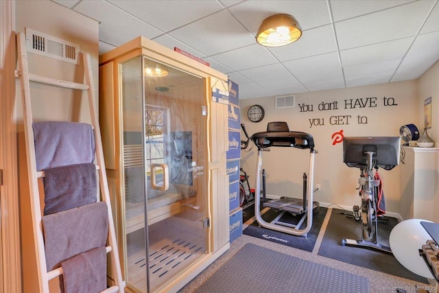 workout room featuring visible vents and a drop ceiling
