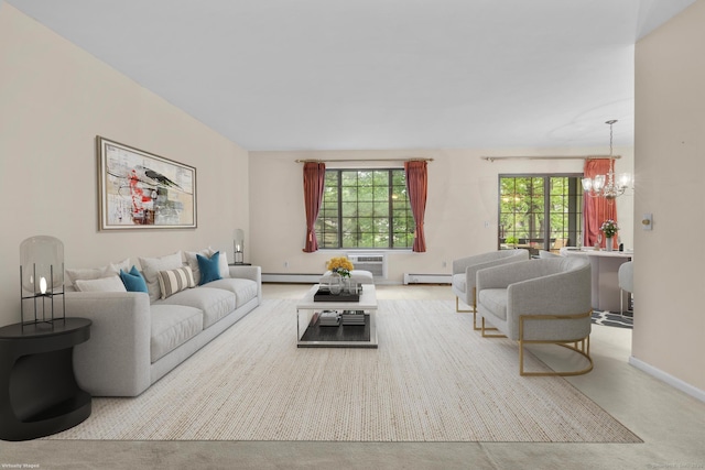 living area with a chandelier, healthy amount of natural light, a baseboard radiator, and baseboards