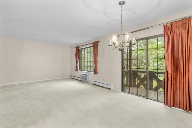 carpeted empty room with a baseboard radiator, a chandelier, baseboards, and healthy amount of natural light