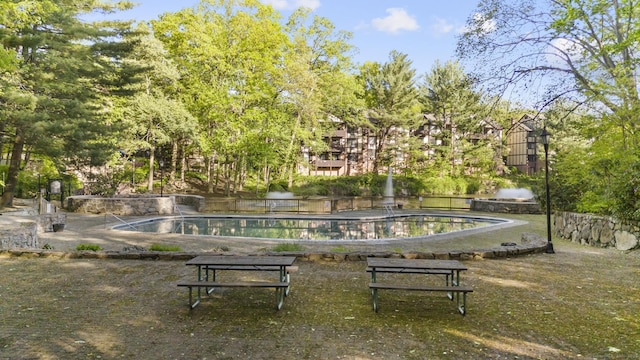 surrounding community featuring a pool