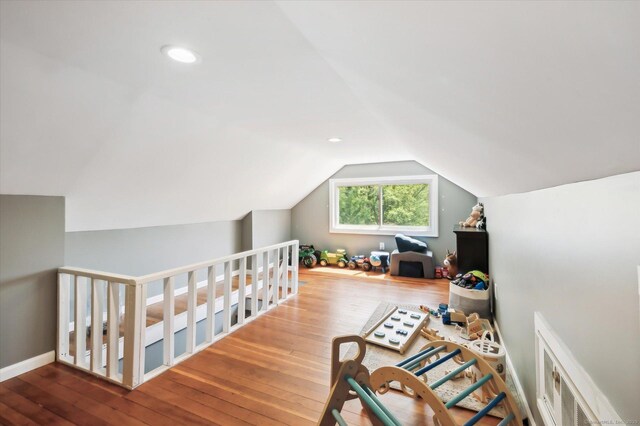 interior space featuring vaulted ceiling and hardwood / wood-style floors