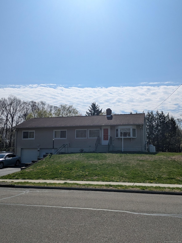 264 Timber Ln, Cheshire, CT 06410 - ranch-style house with entry steps, driveway, a front lawn, and a garage
