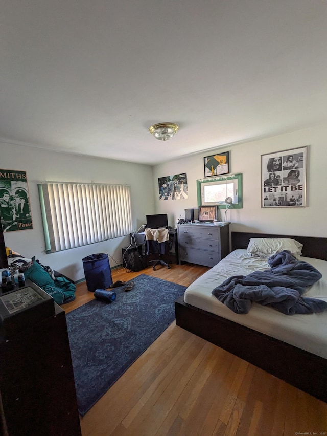 bedroom with wood finished floors
