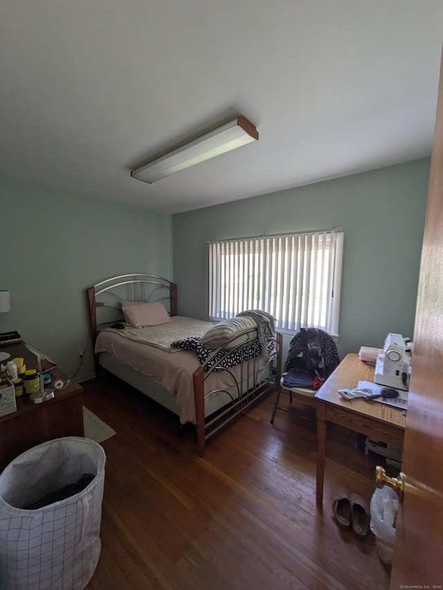 bedroom with wood finished floors