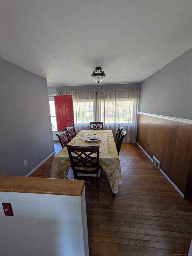 264 Timber Ln, Cheshire, CT 06410 - dining space with visible vents, wainscoting, and hardwood / wood-style flooring