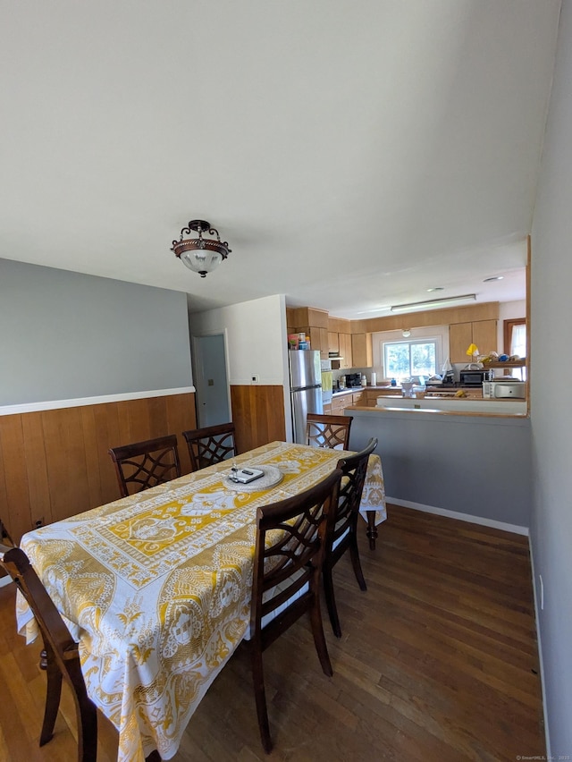 dining space featuring wood finished floors