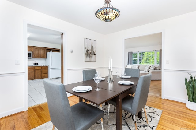 dining area with light wood-style floors