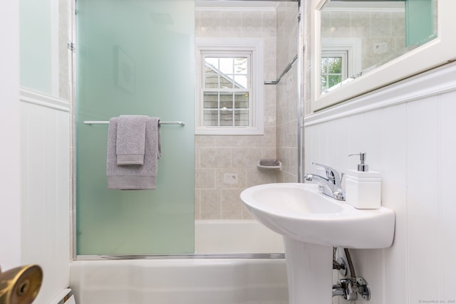 full bathroom featuring shower / bath combination with glass door