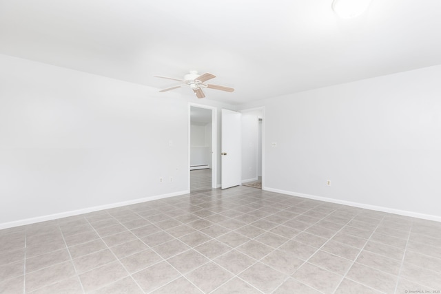 unfurnished room featuring ceiling fan, baseboards, and baseboard heating