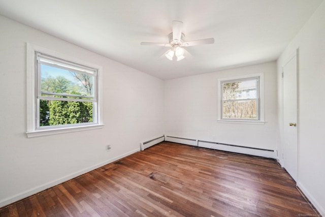 interior space with baseboards, ceiling fan, wood finished floors, and baseboard heating