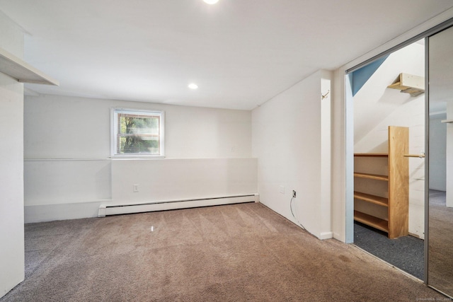 carpeted spare room with recessed lighting and baseboard heating