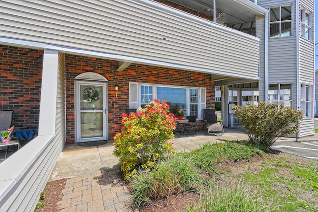 157 Kings Hwy Unit I, Milford, CT 06460 - property entrance with brick siding and a patio area