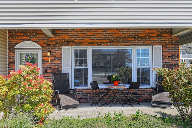 157 Kings Hwy Unit I, Milford, CT 06460 - view of exterior entry featuring brick siding and a patio area