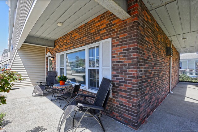 157 Kings Hwy Unit I, Milford, CT 06460 - view of patio featuring a porch