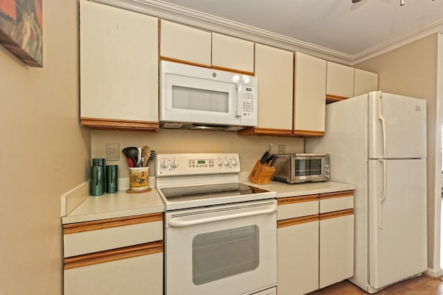 157 Kings Hwy Unit I, Milford, CT 06460 - kitchen featuring a toaster, light countertops, ornamental molding, and white appliances