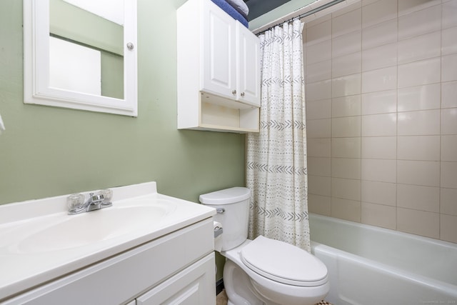 full bathroom featuring toilet, shower / bath combo with shower curtain, and vanity