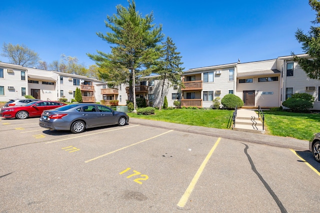 uncovered parking lot with a residential view