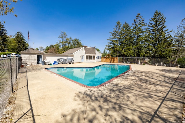 view of pool featuring a patio, fence, and a fenced in pool