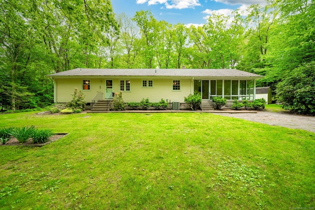 26 Converse Rd, Bolton, CT 06043 - single story home featuring a sunroom, a front lawn, and cooling unit