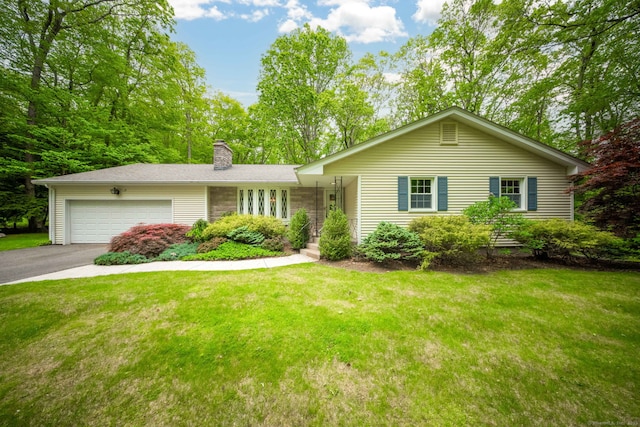 26 Converse Rd, Bolton, CT 06043 - ranch-style house featuring a chimney, a garage, driveway, and a front yard