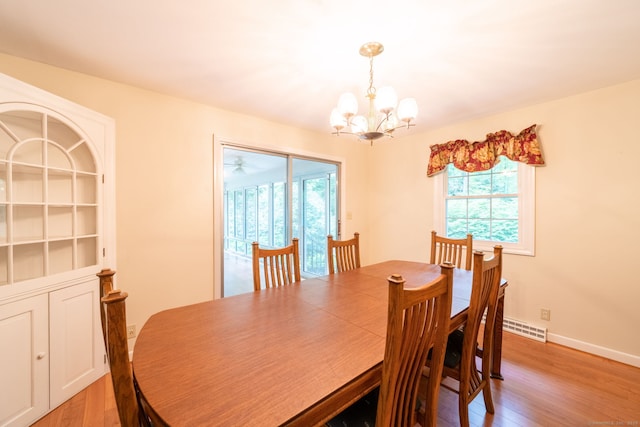 26 Converse Rd, Bolton, CT 06043 - dining space featuring light wood finished floors, healthy amount of natural light, and a chandelier