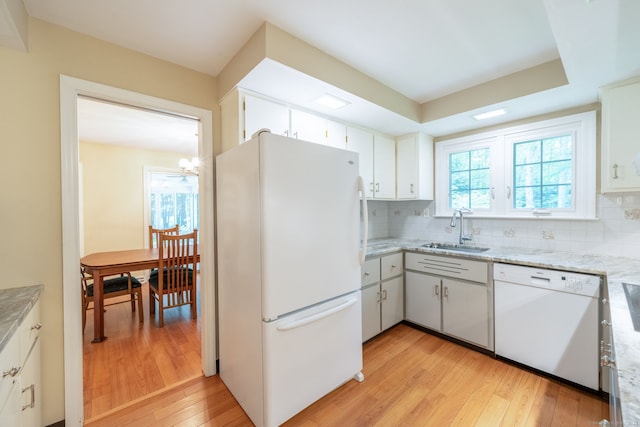26 Converse Rd, Bolton, CT 06043 - kitchen featuring white appliances, a sink, light wood-style flooring, decorative backsplash, and white cabinetry