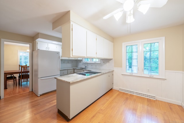 26 Converse Rd, Bolton, CT 06043 - kitchen with freestanding refrigerator, light wood-type flooring, a peninsula, a wainscoted wall, and a ceiling fan