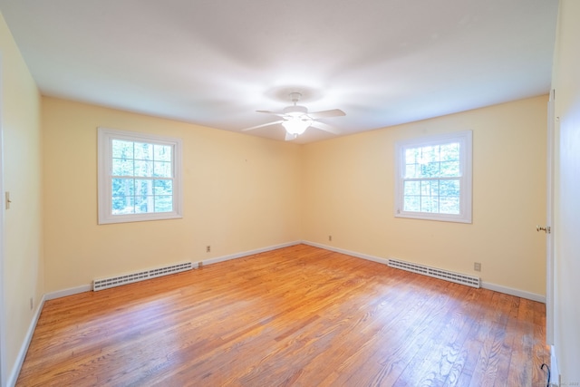 26 Converse Rd, Bolton, CT 06043 - spare room featuring plenty of natural light, light wood-style floors, a baseboard radiator, and ceiling fan