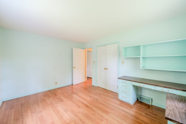 26 Converse Rd, Bolton, CT 06043 - unfurnished office with built in desk, light wood-style floors, and baseboards