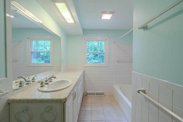 26 Converse Rd, Bolton, CT 06043 - full bathroom with tile walls, healthy amount of natural light, tile patterned flooring, vanity, and shower / bathtub combination