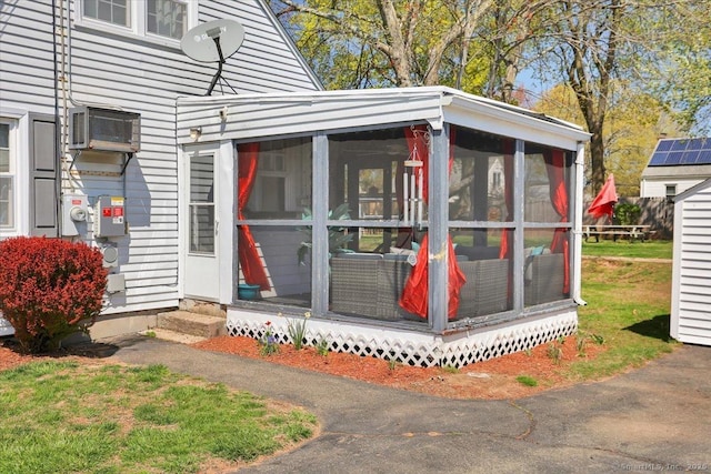 property entrance with an AC wall unit