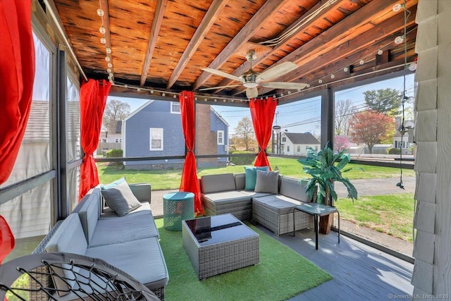 sunroom with an outdoor living space, ceiling fan, and a healthy amount of sunlight